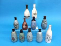 A collection of eleven Japanese World War II military sake bottles