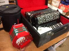 A Guerrini Classic ( Please note there is no model number) piano accordion and a Hohner concertina -