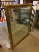 A gilt framed mirror