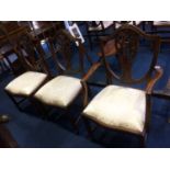 A set of six reproduction mahogany Chapmans 'Siesta' dining chairs, comprising four single and two