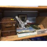 Shelf of assorted including sewing machines