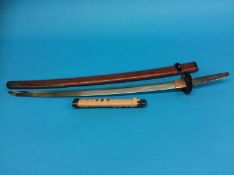 A Japanese Katana with red lacquered scabbard, length of blade 58cm