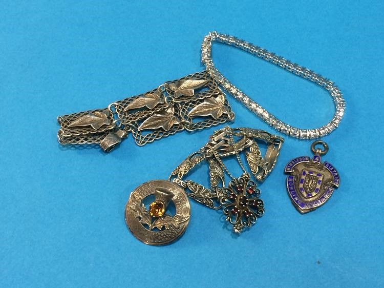 A Scottish silver brooch, a fob etc.