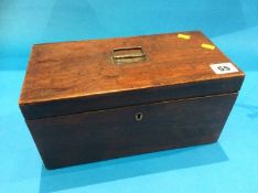 A mahogany tea caddy with fitted interior