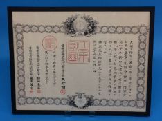 A Japanese framed document given by the Emperor Meini to 'Hakamada', an infantryman, bears date