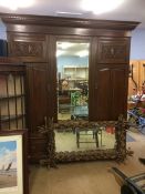 An Edwardian mahogany triple wardrobe