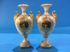 A pair of Royal Worcester baluster form vases, with central roundels painted with fruit by Edward