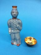 A rare Japanese army soldier sake bottle (one of the bullet warriors), and a metal helmet sake cup