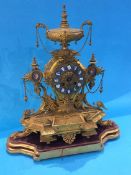 A gilt metal mantle clock, the movement stamped 'W.H. Tooke Paris'