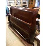 A mahogany sleigh bed frame