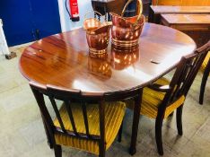 A mahogany D end dining table and three chairs