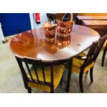 A mahogany D end dining table and three chairs