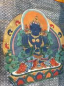 An elaborately painted Tibetan Thangka