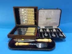 Set of plated grapefruit spoons, fish servers etc.