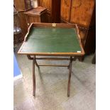 An oak campaign style folding writing table