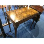 A walnut Queen Anne style fold over card table, with pad feet, 76cm wide