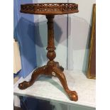 A reproduction mahogany octagonal occasional table