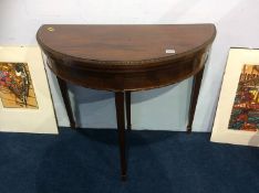 An Edwardian mahogany demi lune fold over card table, 84cm wide