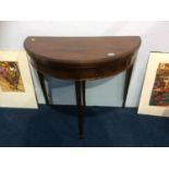 An Edwardian mahogany demi lune fold over card table, 84cm wide