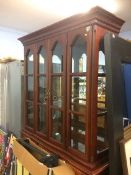 A mahogany table, six chairs a display cabinet and 4 bar stools