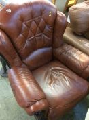 Brown leather armchair