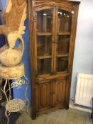 Oak linenfold corner cabinet