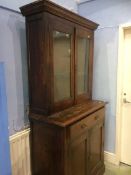 A stained pine display cabinet