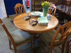 Jentique oak extending circular table and four chairs