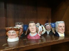 Six small Royal Doulton toby jugs