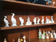 Nine Lladro and Nao swans