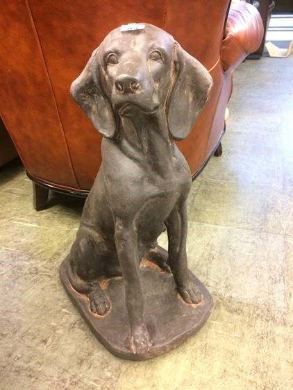 Cast resin figure of a seated dog
