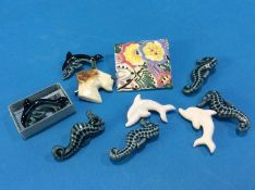 A collection of Poole pottery brooches