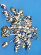 Large collection of enamelled spoons, predominantly silver, 626 grams