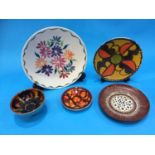 Four shallow Poole pottery dishes and a small bowl (5)