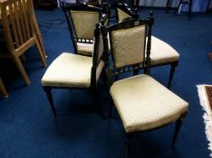 A set of four aesthetic movement black painted single chairs by Blyth and Sons, Chiswell London
