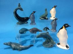 Four Poole pottery penguins, a whale, three seals, leaping salmon, a miniature dolphin and an