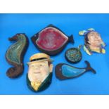 A Beswick 'Whale' dish, 'Fish' dish and a 'Seahorse' dish, two Beswick wall masks, 282 and 274 and a