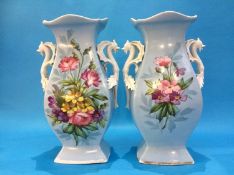A large pair of Victorian vases on a turquoise ground, decorated with flowers