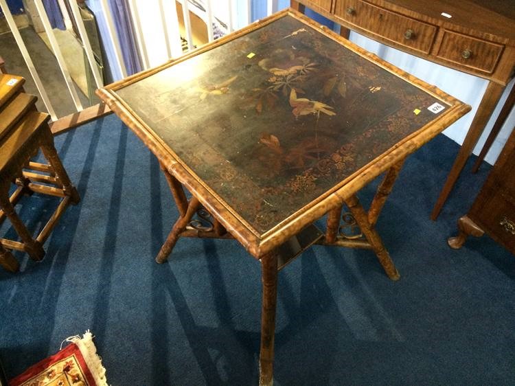 A Victorian bamboo side table with lacquered top