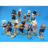 A collection of twelve Beswick Pig Band players (boxed)