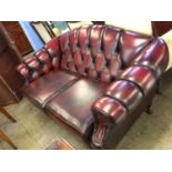 A Chesterfield oxblood two seater settee