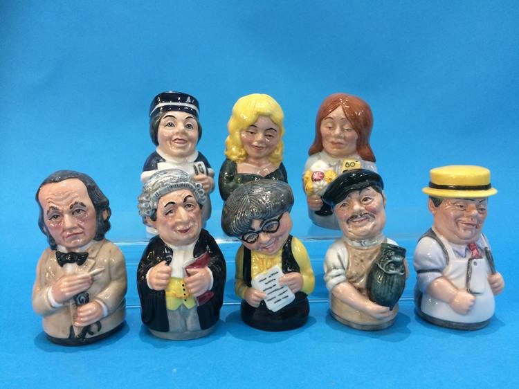 A set of eight Royal Doulton figures
