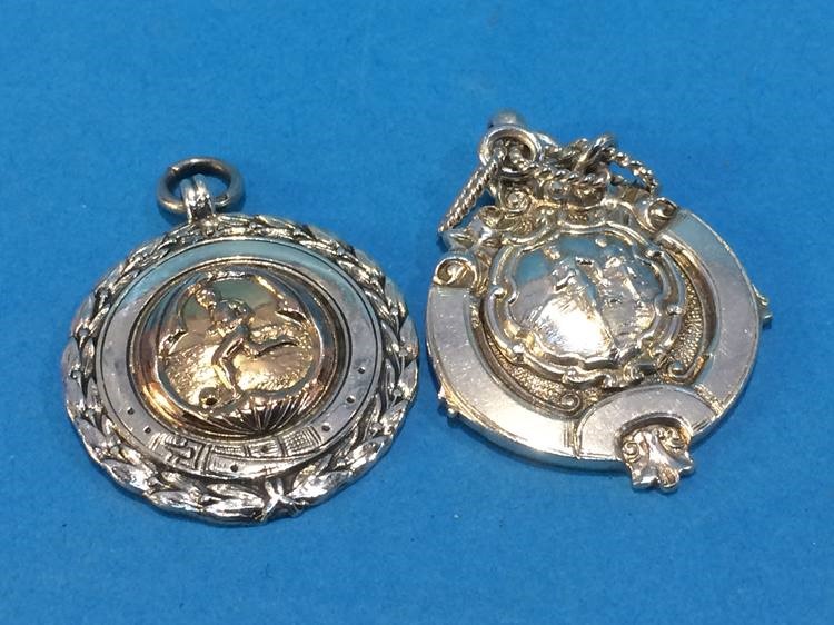 Two silver fobs