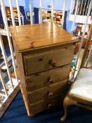 A modern narrow pine chest of drawers