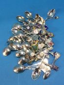 Large collection of enamelled spoons, predominantly silver, 629 grams