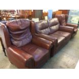 A brown leather three piece suite