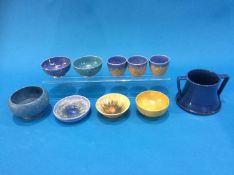 A Barum ware pot, four Ruskin bowls, three Ruskin