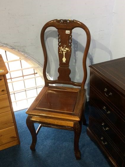 An Oriental style hardwood single chair inlaid with mother of pearl