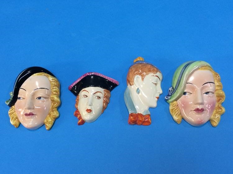 Four Beswick Art Deco wall masks, numbered 363, 36