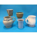 A Poole tankard with dolphin handle, a Carter Stabler jug, T313 and three Poole vases (5)